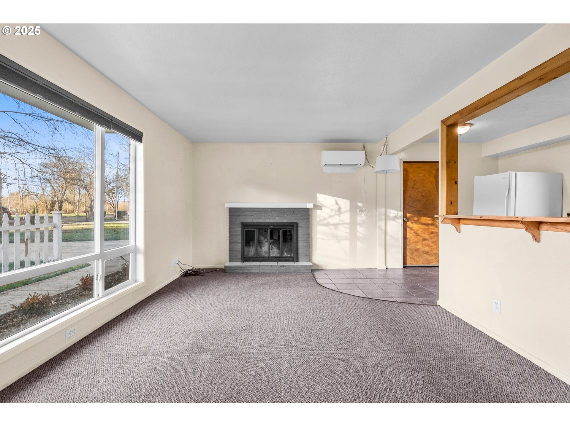 3875 East Amazon Drive Eugene, OR 97405 - Photo 7 of 33 a view of an empty room with a fireplace