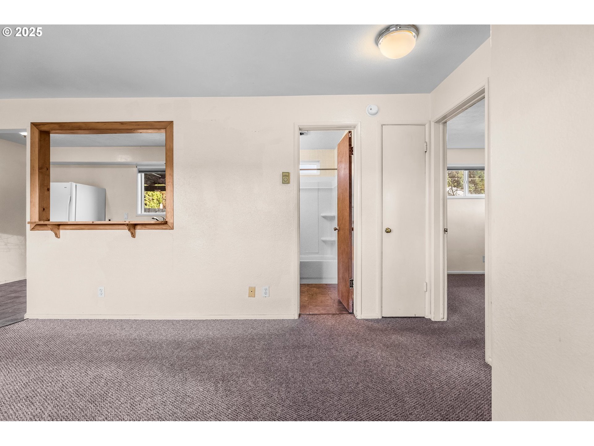 3875 East Amazon Drive Eugene, OR 97405 - Photo 8 of 33 a view of a room with a hallway and a closet