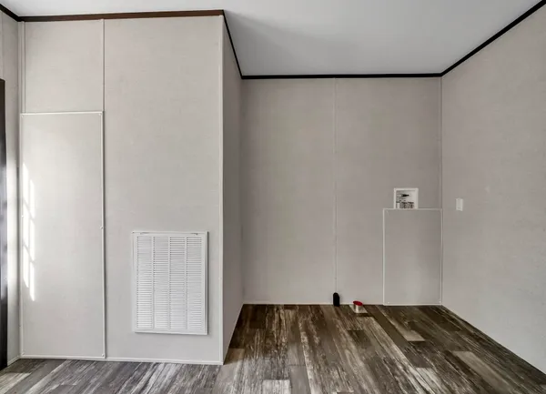 a view of a closet with wooden floor