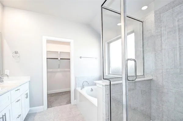 an empty room with closet and a chandelier fan