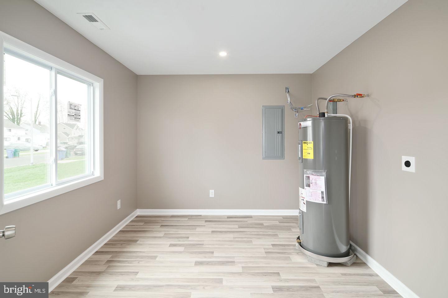 53 Greenbriar Road Levittown, PA 19057 - Photo 22 of 25 a view of a room with wooden floor and cabinet