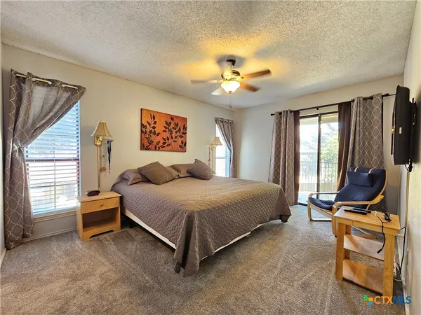 a bedroom with a bed and furniture