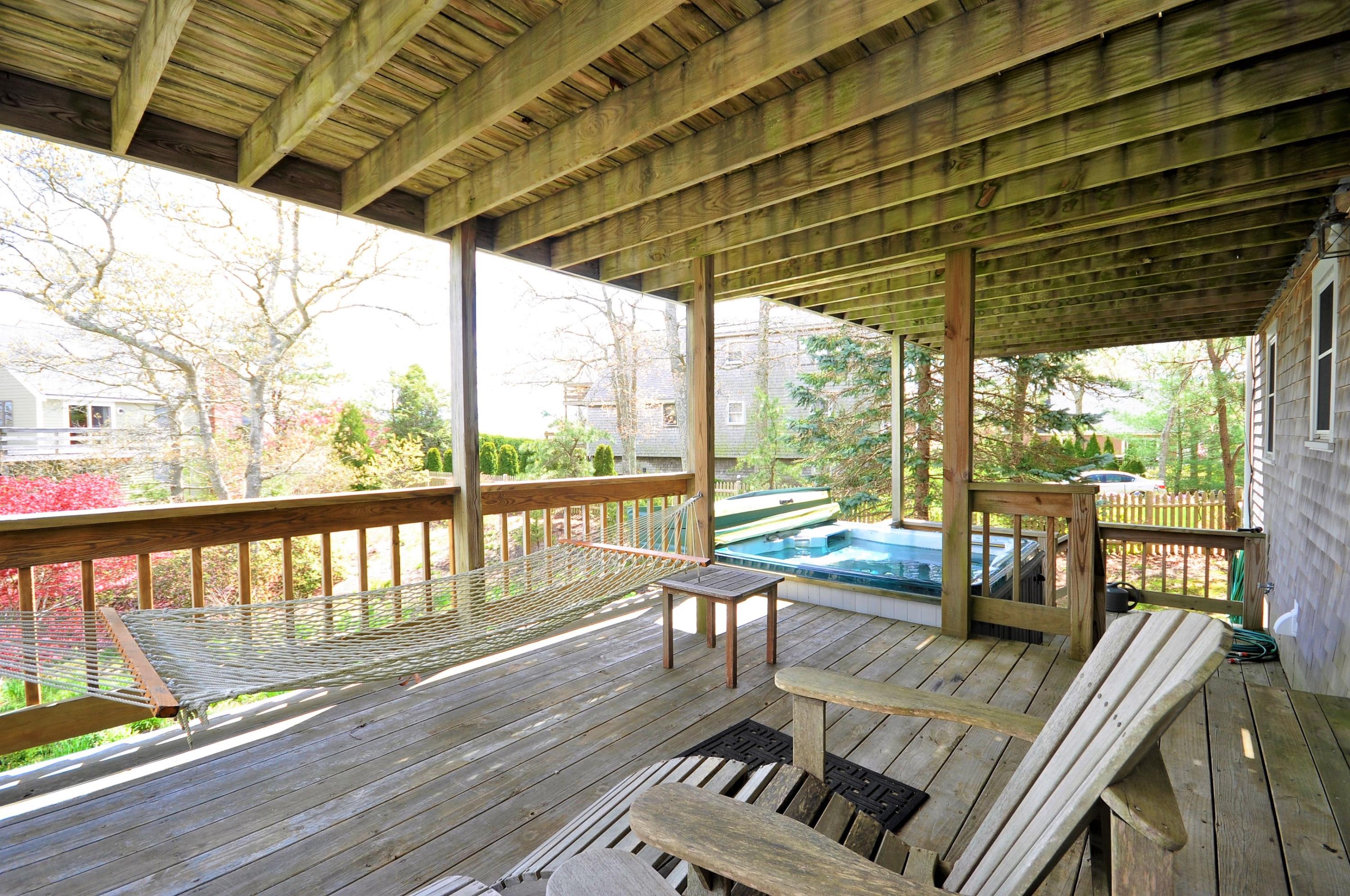 8 McGrath Road Sagamore Beach, MA 02562 - Photo 14 of 25 a view of balcony with wooden floor and outdoor seating