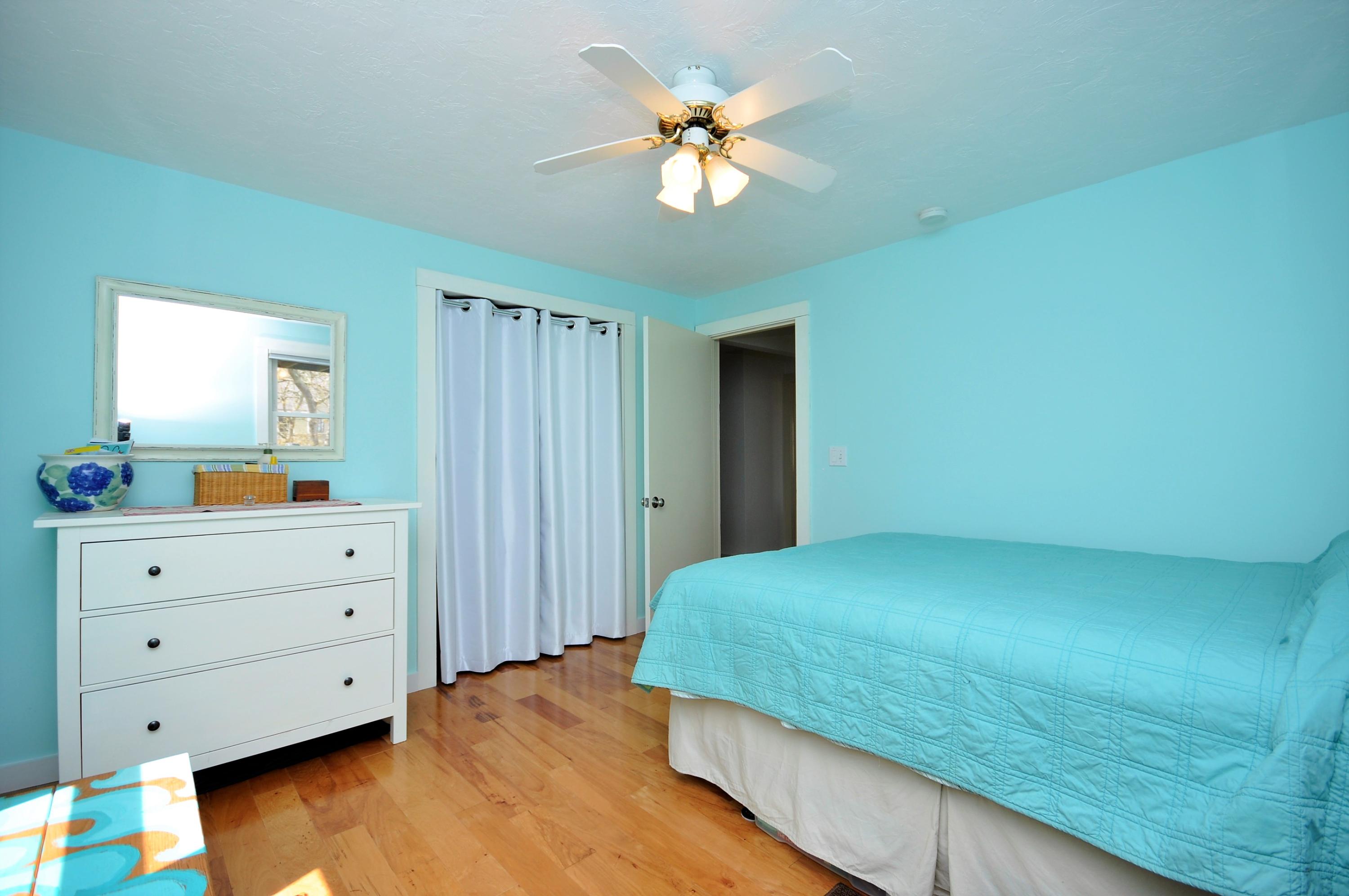 8 McGrath Road Sagamore Beach, MA 02562 - Photo 17 of 25 a bedroom with a bed and a dresser
