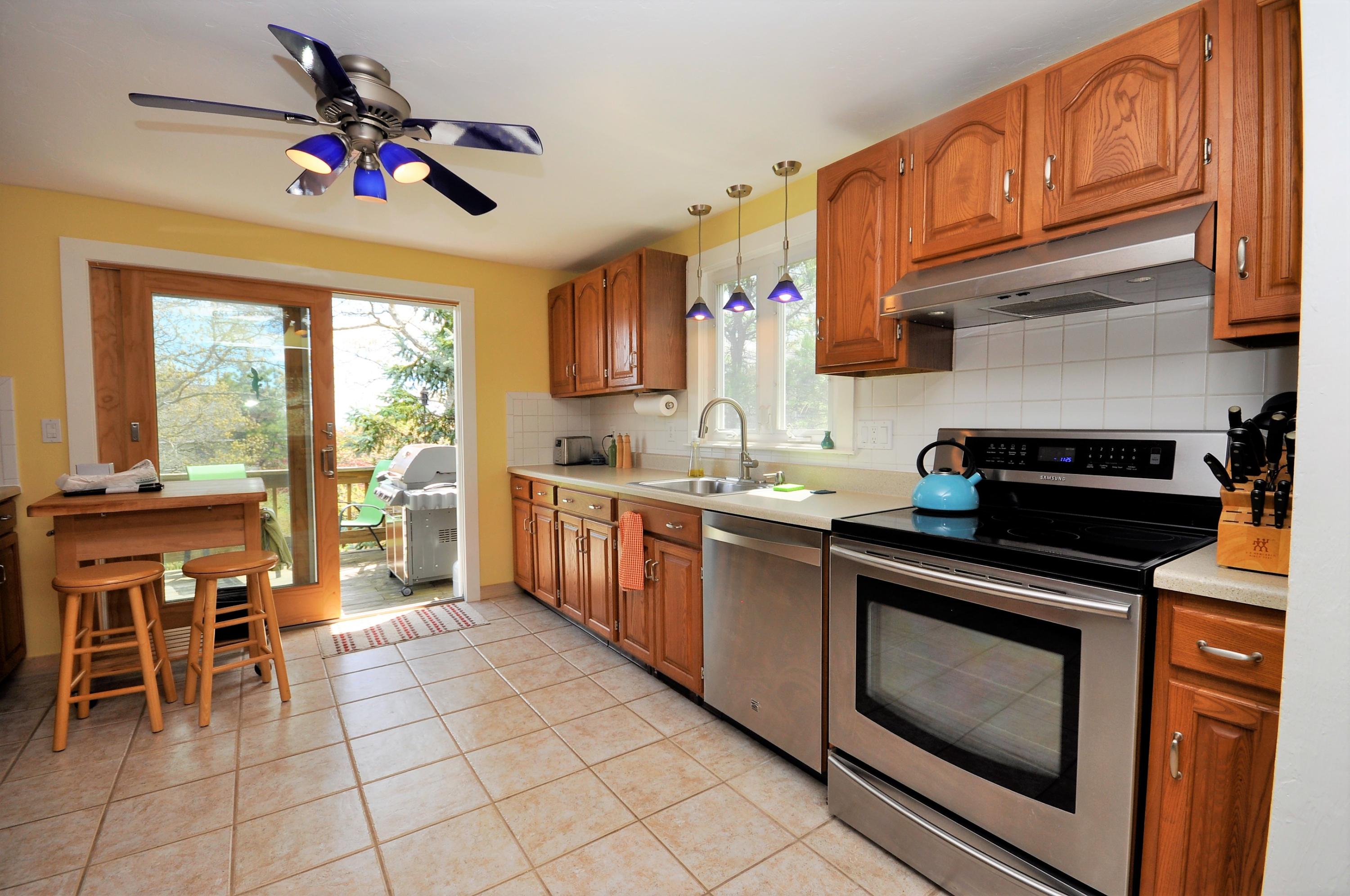 8 McGrath Road Sagamore Beach, MA 02562 - Photo 2 of 25 a kitchen with granite countertop cabinets stainless steel appliances a sink and a stove top oven