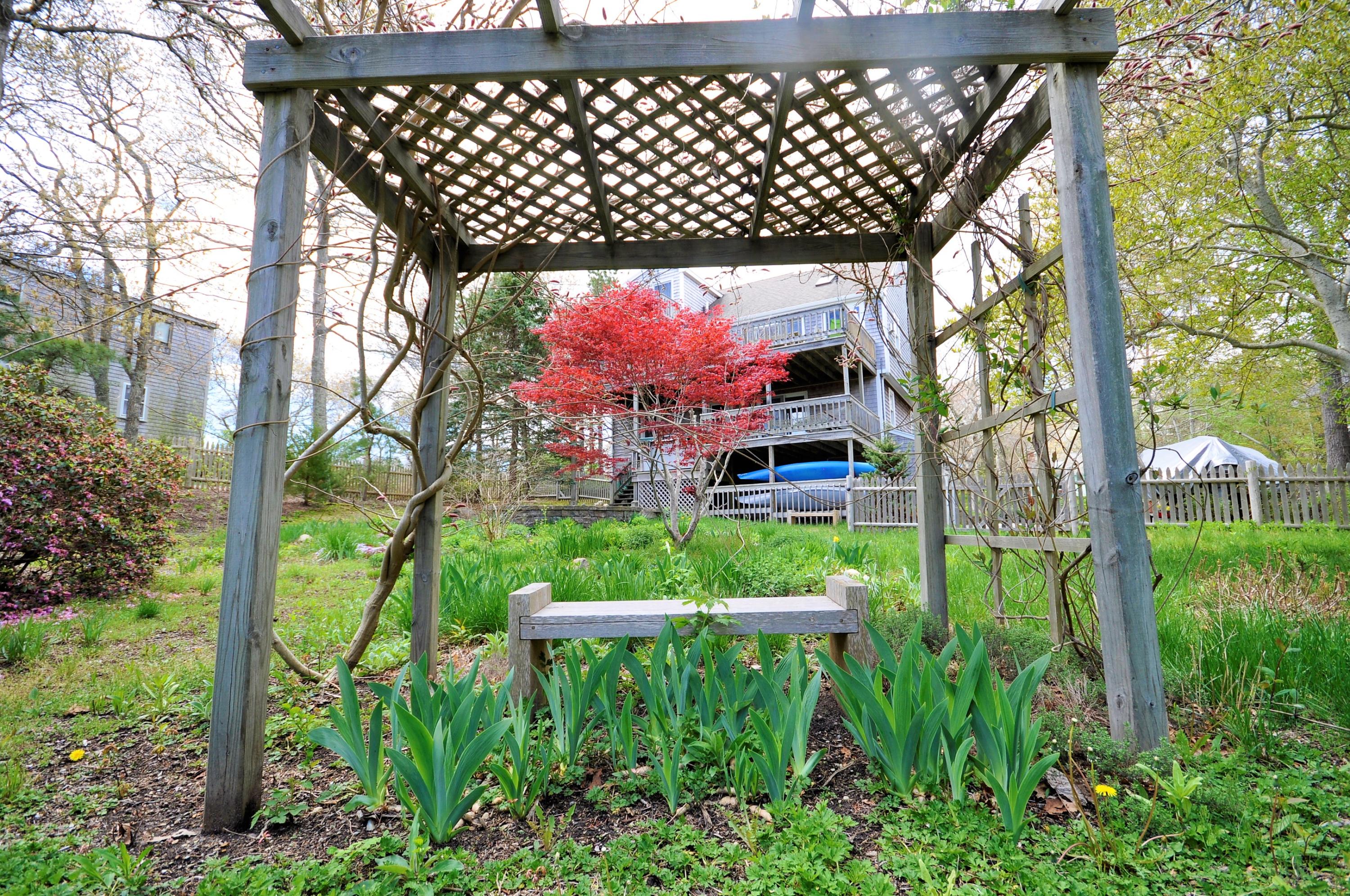 8 McGrath Road Sagamore Beach, MA 02562 - Photo 24 of 25 a backyard of a house with lots of green space