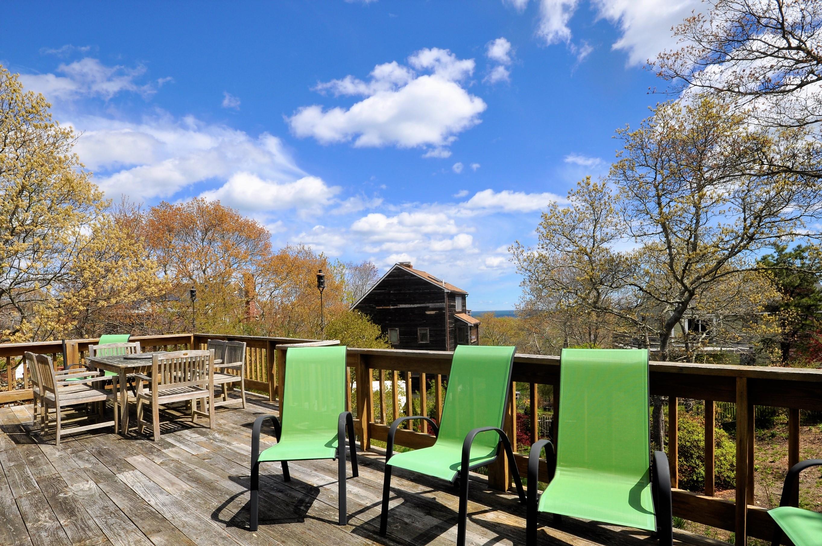 8 McGrath Road Sagamore Beach, MA 02562 - Photo 4 of 25 a view of a chairs and table in the balcony