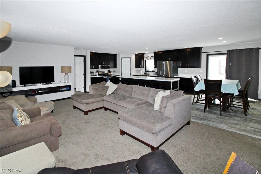 1609 Coldwater Crossing Road Lakeside Marblehead, OH 43440 - Photo 11 of 38 Living room featuring light carpet