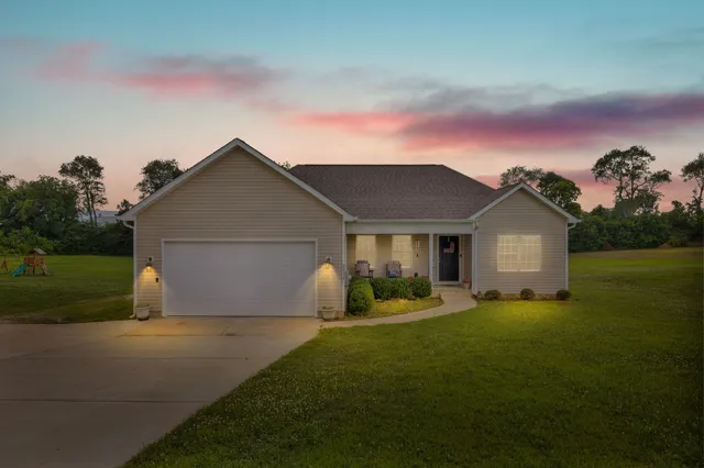 a view of a yard in front of a house with a yard