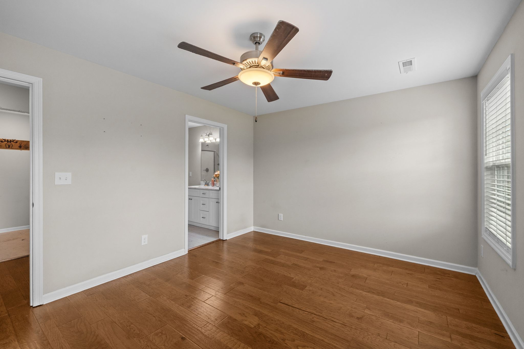 3232 Owl Hollow Road Belvidere, TN 37306 - Photo 14 of 43 wooden floor in an empty room with a window