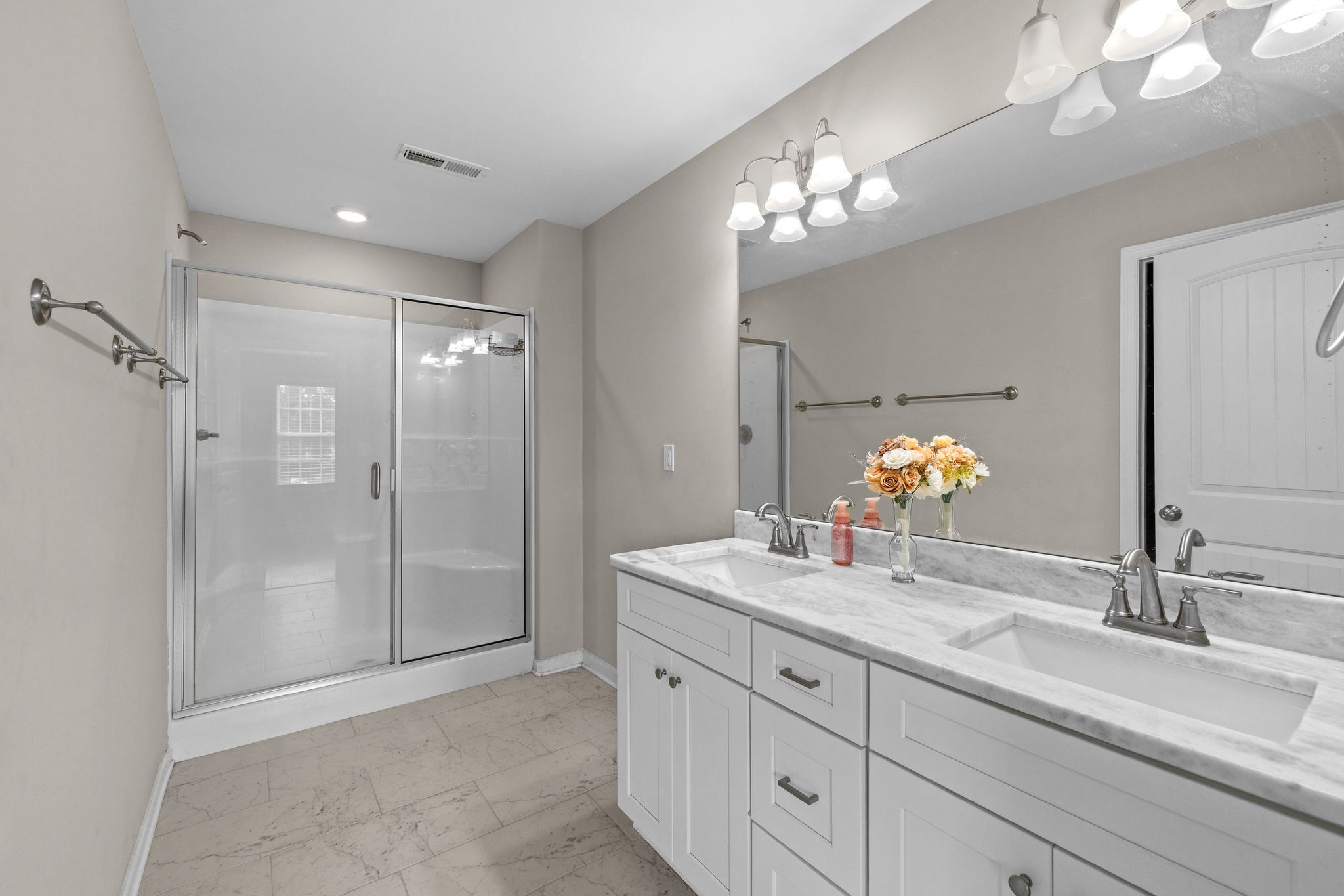 3232 Owl Hollow Road Belvidere, TN 37306 - Photo 16 of 43 a bathroom with a sink double vanity and a shower