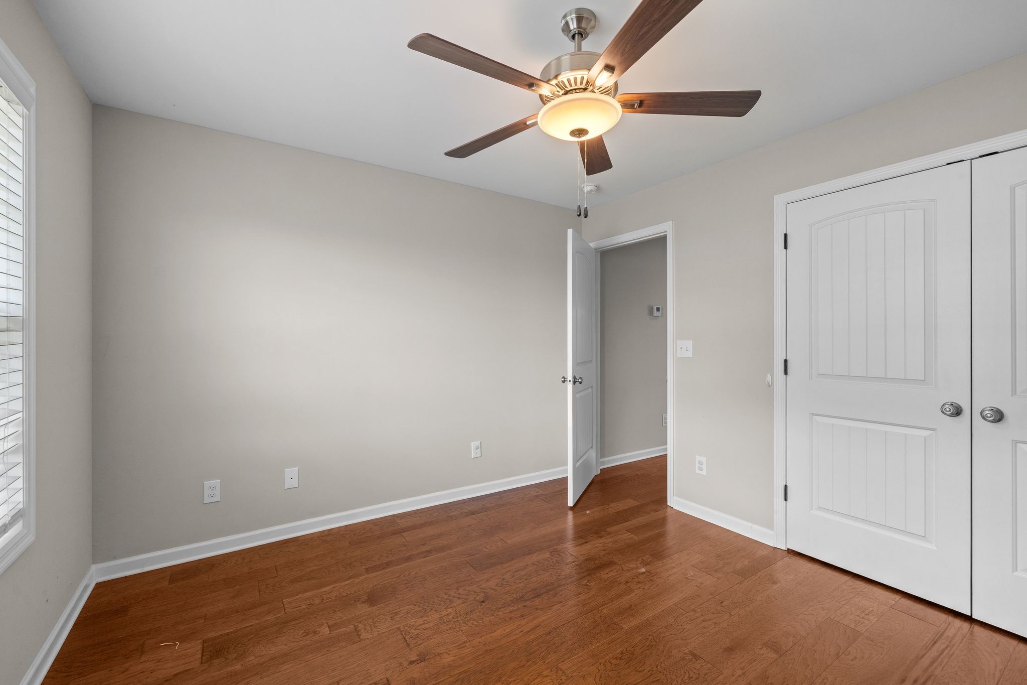 3232 Owl Hollow Road Belvidere, TN 37306 - Photo 21 of 43 an empty room with wooden floor and windows