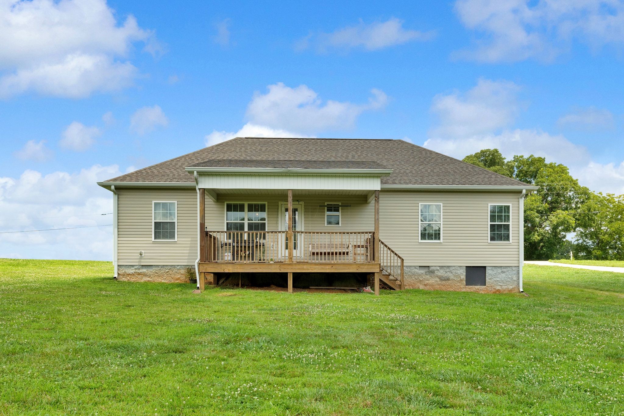 3232 Owl Hollow Road Belvidere, TN 37306 - Photo 28 of 43 a front view of a house with a garden and deck