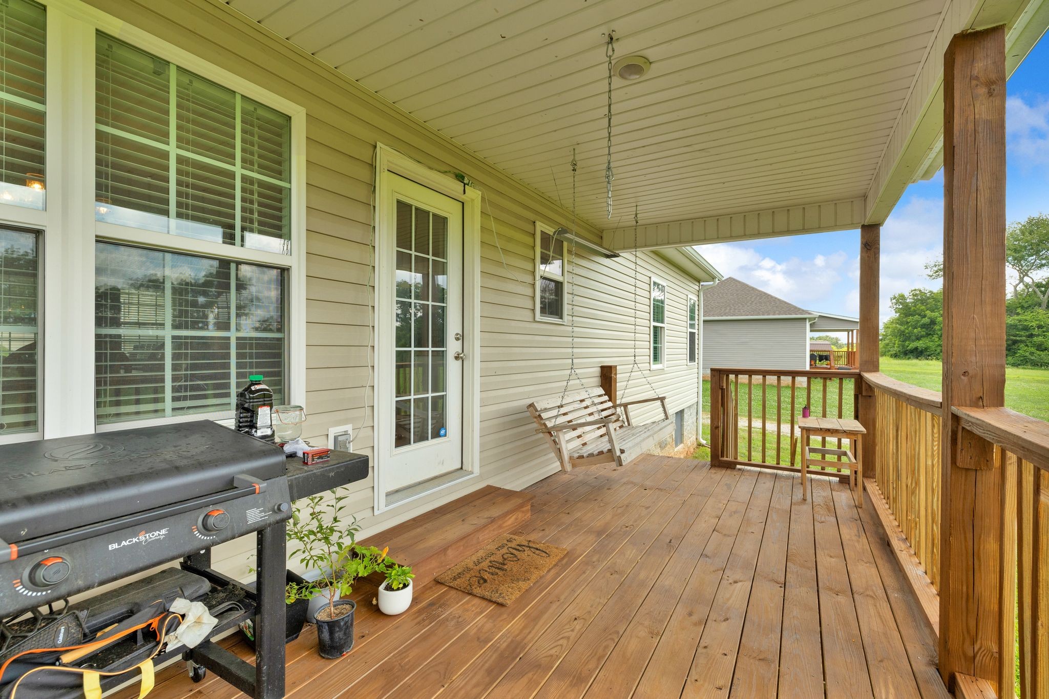 3232 Owl Hollow Road Belvidere, TN 37306 - Photo 3 of 43 a balcony with wooden floor and furniture