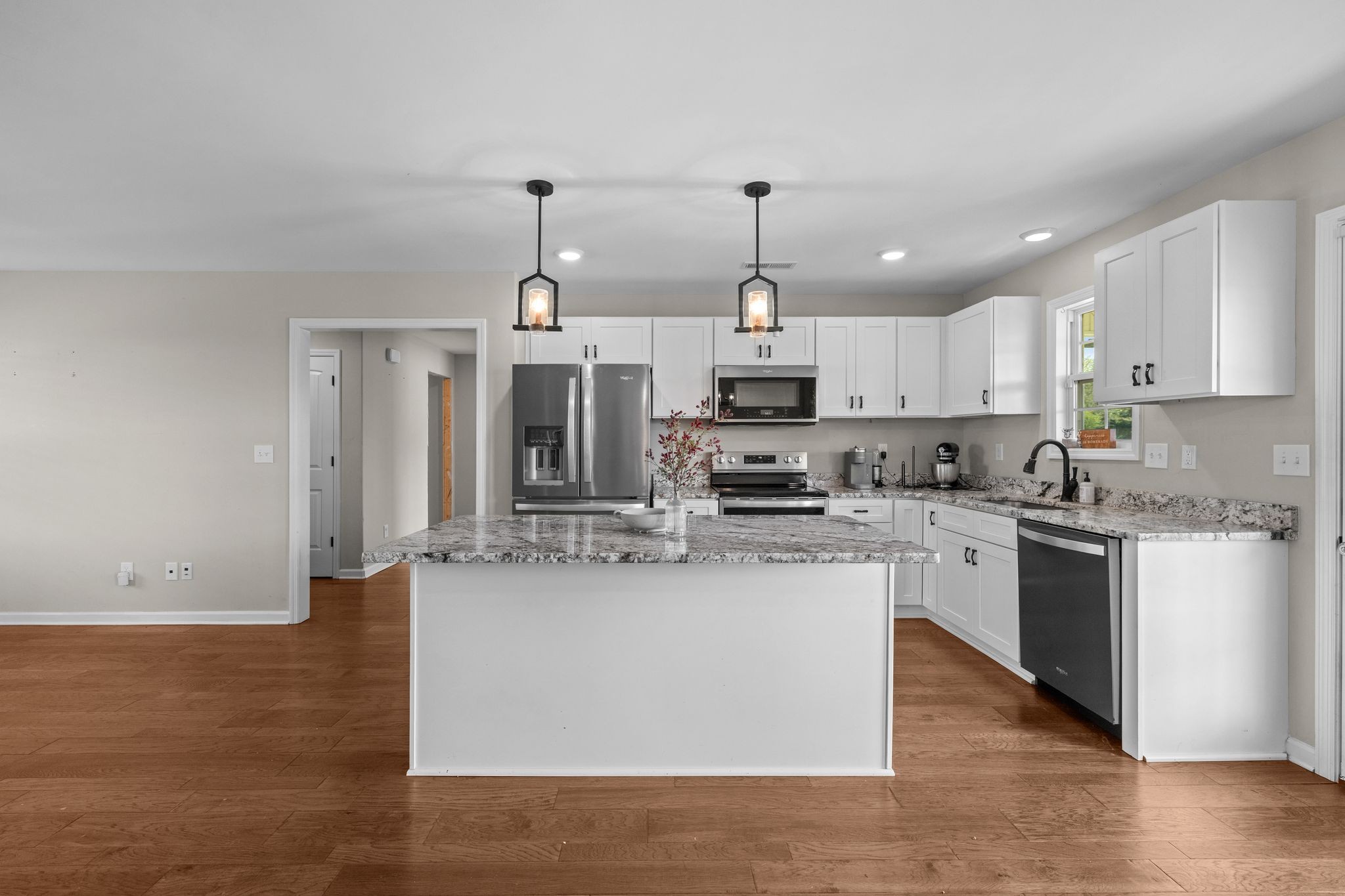 3232 Owl Hollow Road Belvidere, TN 37306 - Photo 7 of 43 a kitchen with stainless steel appliances a sink a stove a refrigerator and cabinets