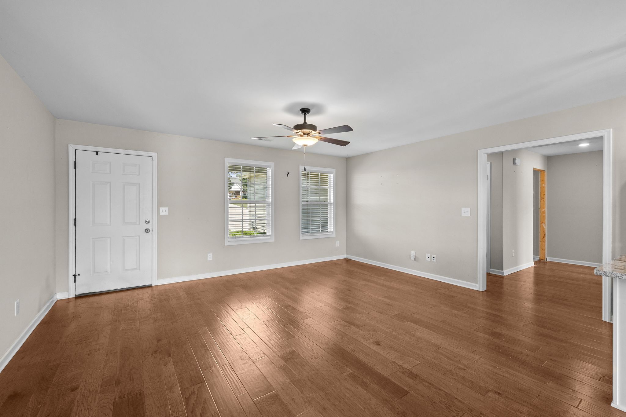 3232 Owl Hollow Road Belvidere, TN 37306 - Photo 9 of 43 a view of an empty room with wooden floor and a window