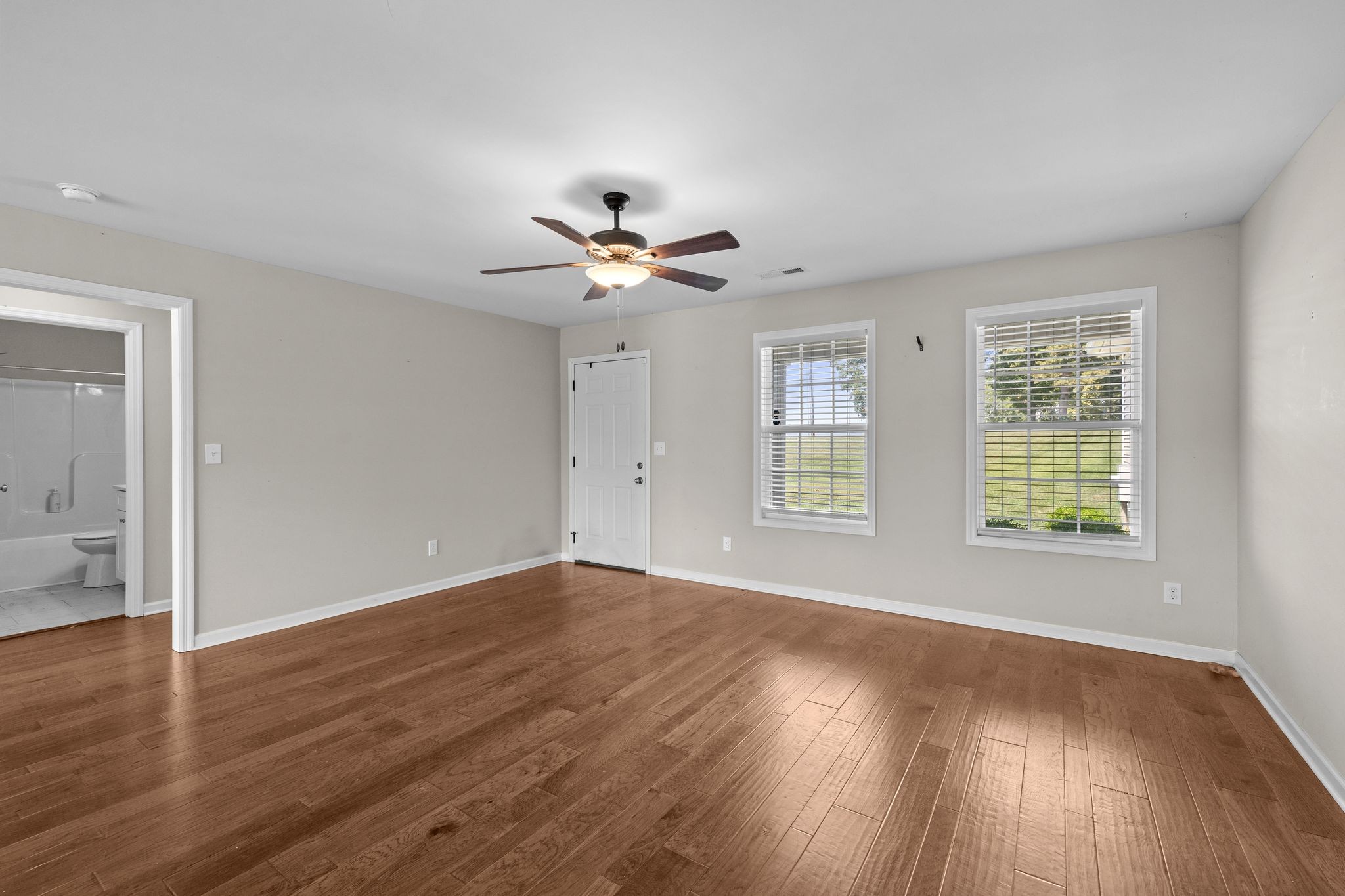 3232 Owl Hollow Road Belvidere, TN 37306 - Photo 10 of 43 a view of an empty room with wooden floor and a window