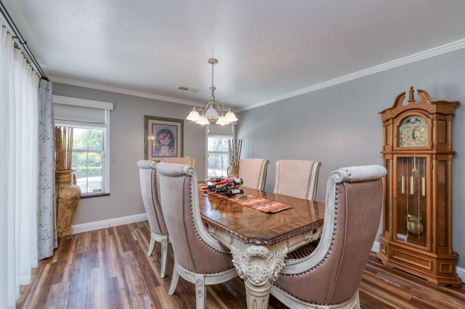 25106 Ave 18 Madera, CA 93638 - Photo 17 of 66 a view of a dining room with furniture window and wooden floor
