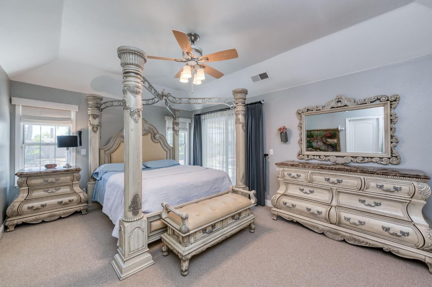 25106 Ave 18 Madera, CA 93638 - Photo 23 of 66 a bed room with a bed and a television