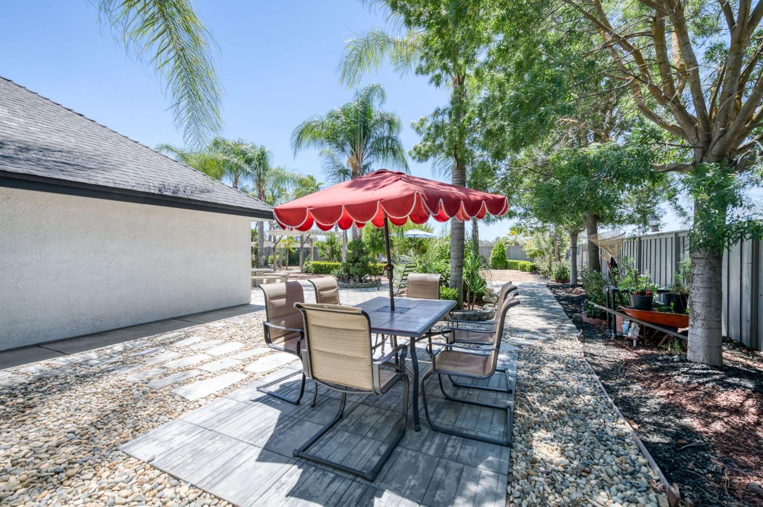 25106 Ave 18 Madera, CA 93638 - Photo 31 of 66 a view of a dining table and chairs in patio