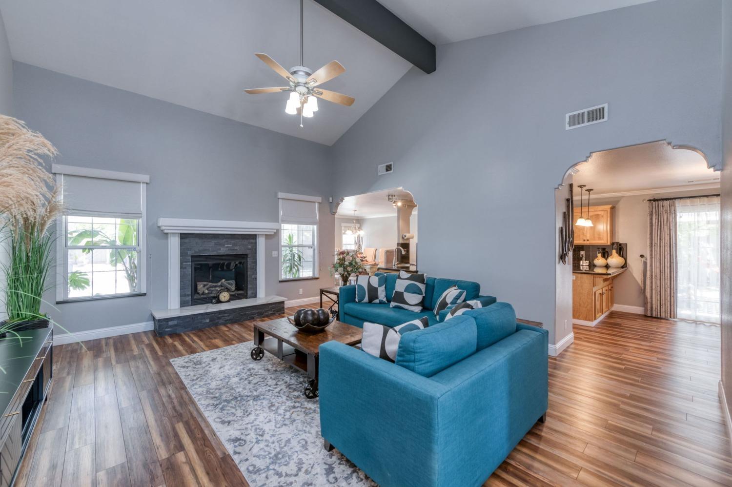25106 Ave 18 Madera, CA 93638 - Photo 4 of 66 a living room with furniture and a fireplace