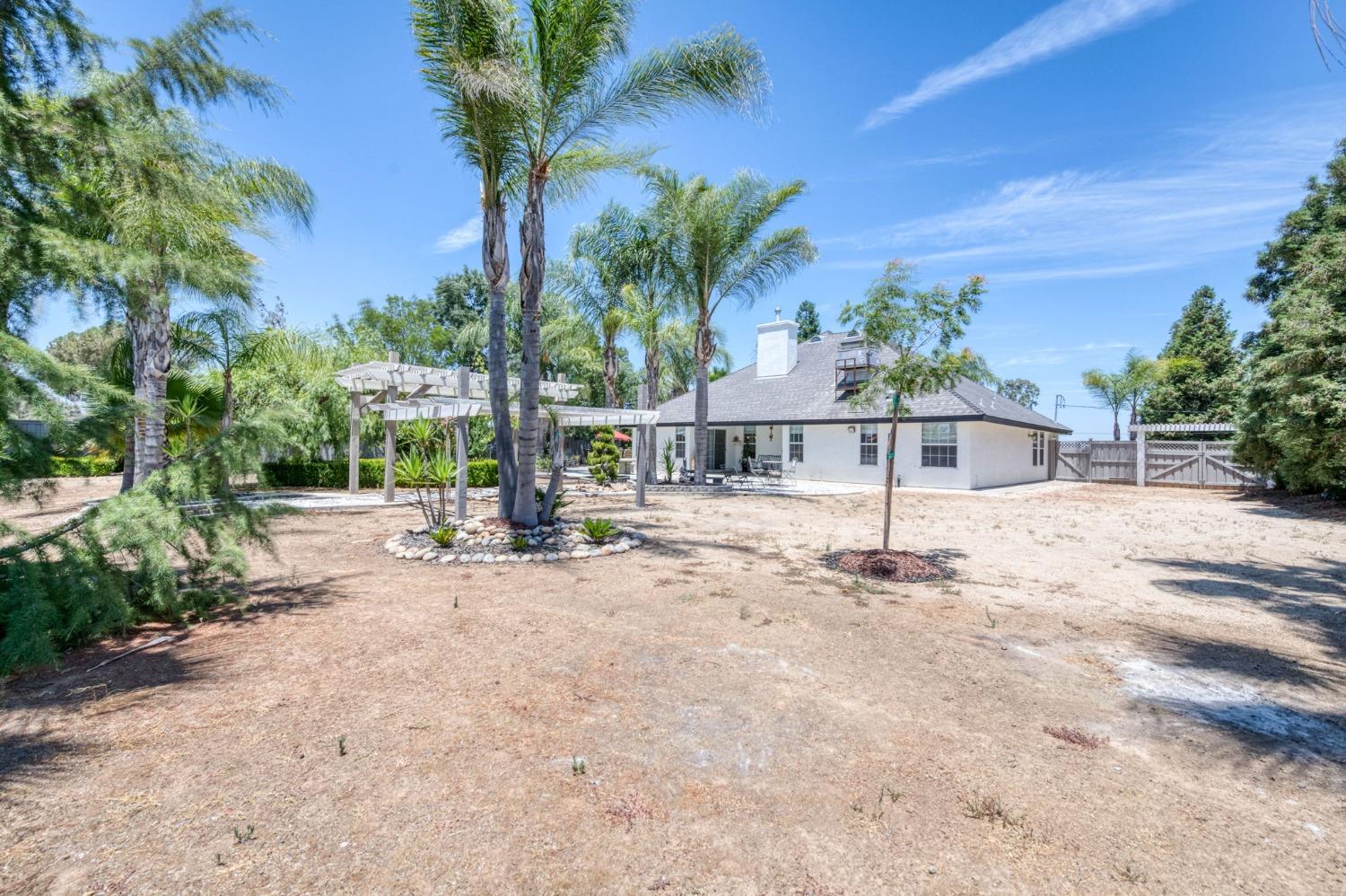 25106 Ave 18 Madera, CA 93638 - Photo 41 of 66 a view of house with outdoor space and sitting area