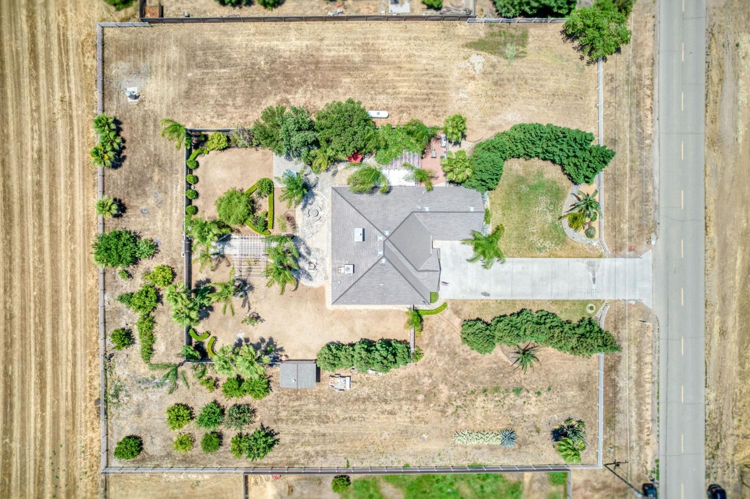 25106 Ave 18 Madera, CA 93638 - Photo 51 of 66 an aerial view of a house with a lake view