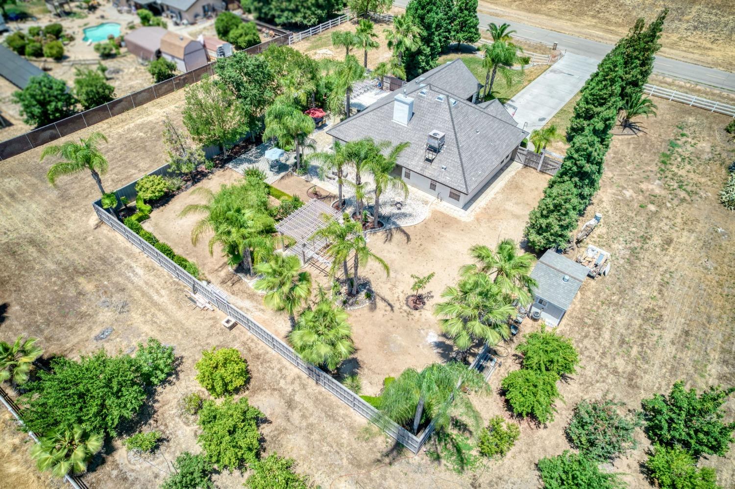 25106 Ave 18 Madera, CA 93638 - Photo 57 of 66 an aerial view of a house with a yard