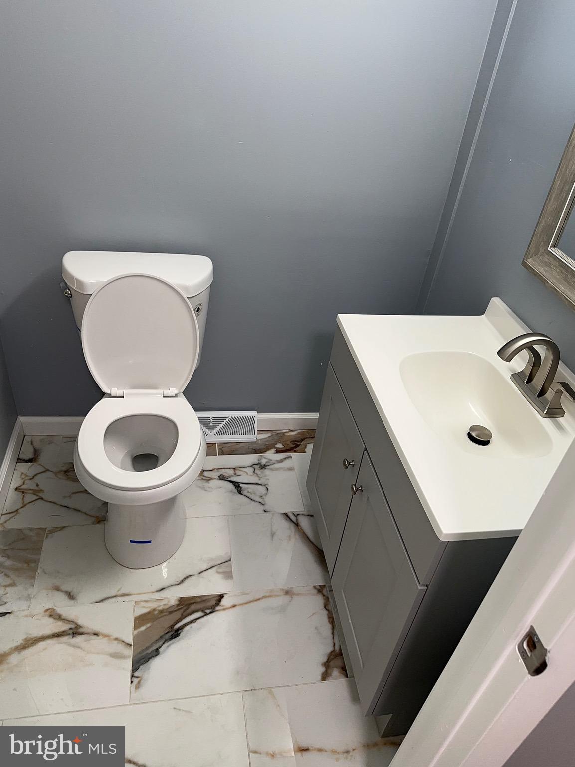 1002 North Pine Street Wilmington, DE 19801 - Photo 14 of 29 a bathroom with a sink and a toilet