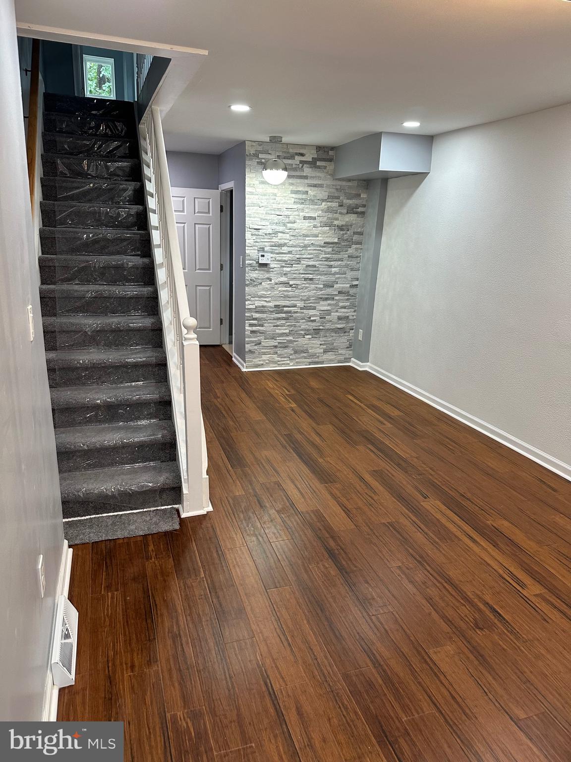 1002 North Pine Street Wilmington, DE 19801 - Photo 8 of 29 wooden floor in an empty room with stairs