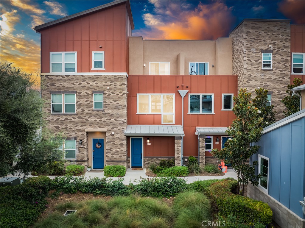 8847 Jacaranda Avenue, Unit C Montclair, CA 91763 - Photo 1 of 34 a front view of a house with plants and garden