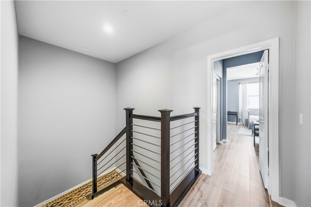 8847 Jacaranda Avenue, Unit C Montclair, CA 91763 - Photo 16 of 34 a view of a hallway with a white walls and stairs