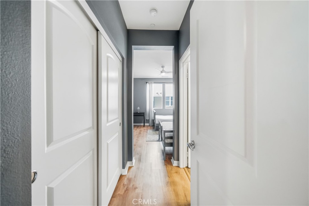 8847 Jacaranda Avenue, Unit C Montclair, CA 91763 - Photo 17 of 34 a view of a hallway with wooden floor and a living room