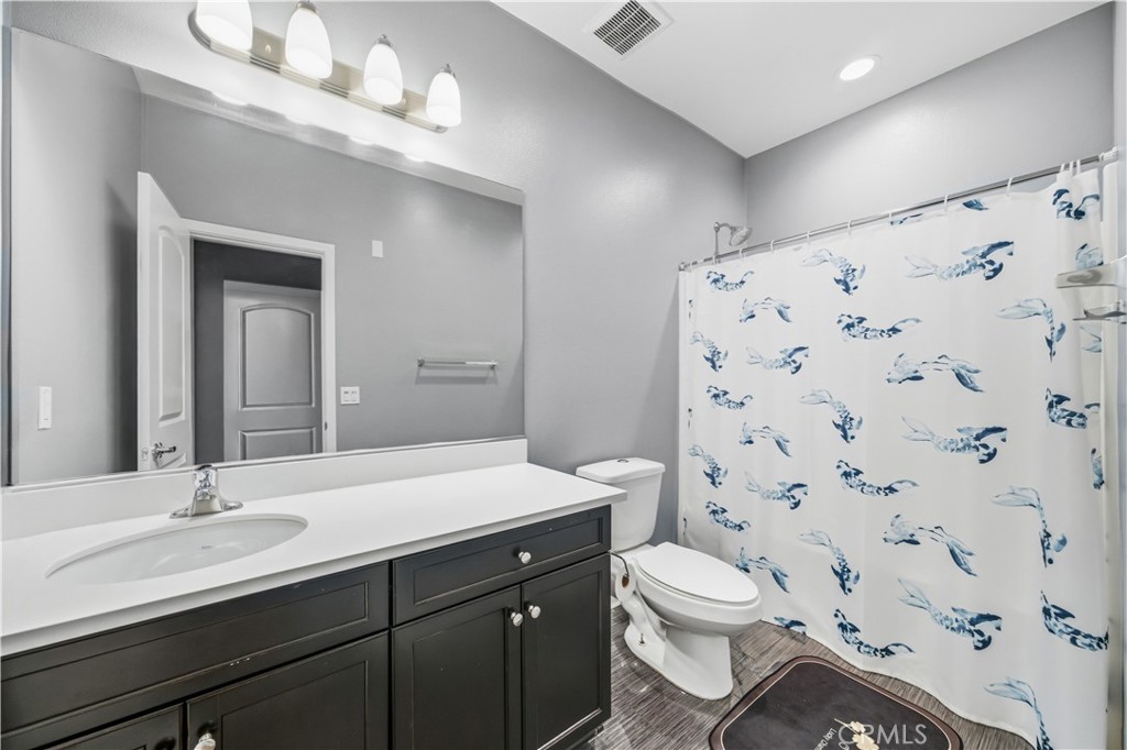 8847 Jacaranda Avenue, Unit C Montclair, CA 91763 - Photo 18 of 34 a bathroom with a sink a toilet and shower