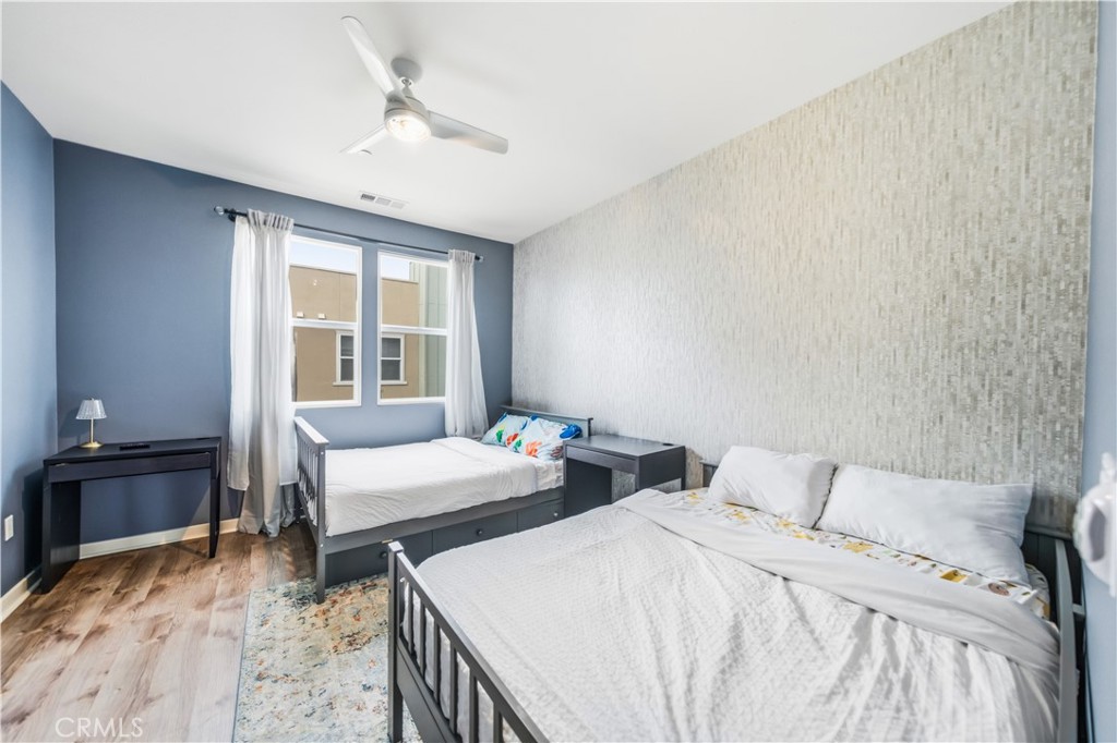 8847 Jacaranda Avenue, Unit C Montclair, CA 91763 - Photo 20 of 34 a bedroom with two beds and a desk