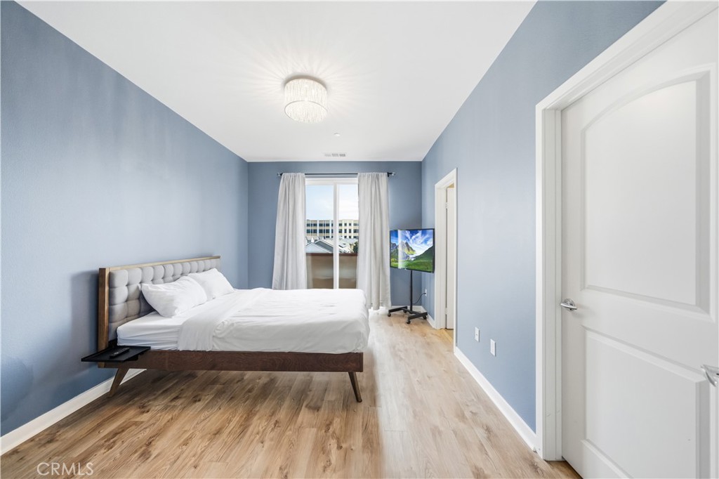 8847 Jacaranda Avenue, Unit C Montclair, CA 91763 - Photo 22 of 34 a bedroom with a bed and a window