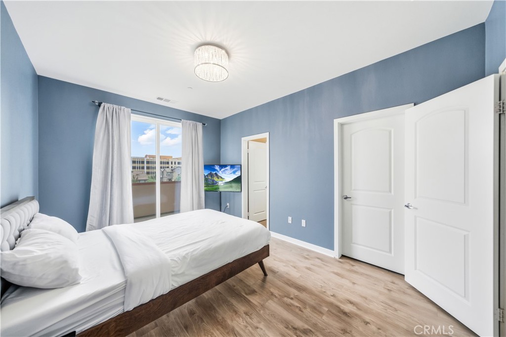 8847 Jacaranda Avenue, Unit C Montclair, CA 91763 - Photo 23 of 34 a bedroom with a bed and a window