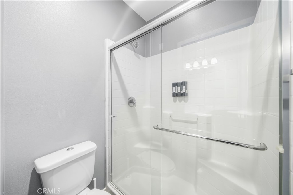 8847 Jacaranda Avenue, Unit C Montclair, CA 91763 - Photo 28 of 34 a bathroom with a shower and toilet