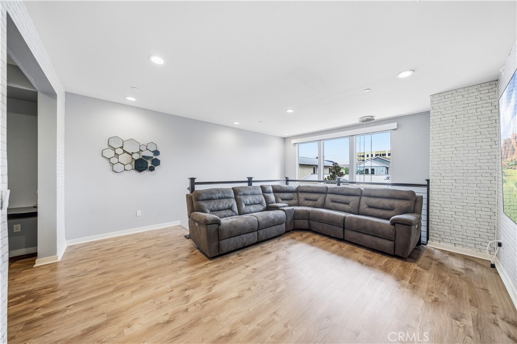 8847 Jacaranda Avenue, Unit C Montclair, CA 91763 - Photo 10 of 34 a living room with furniture and kitchen view