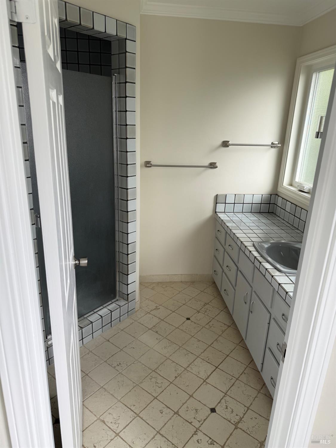 16 Harbor View Court San Rafael, CA 94901 - Photo 14 of 20 a bathroom with a granite countertop sink and a mirror