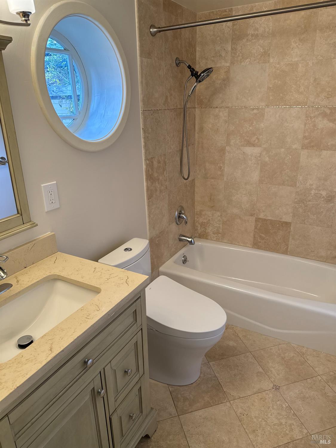 16 Harbor View Court San Rafael, CA 94901 - Photo 17 of 20 a bathroom with a sink and a mirror