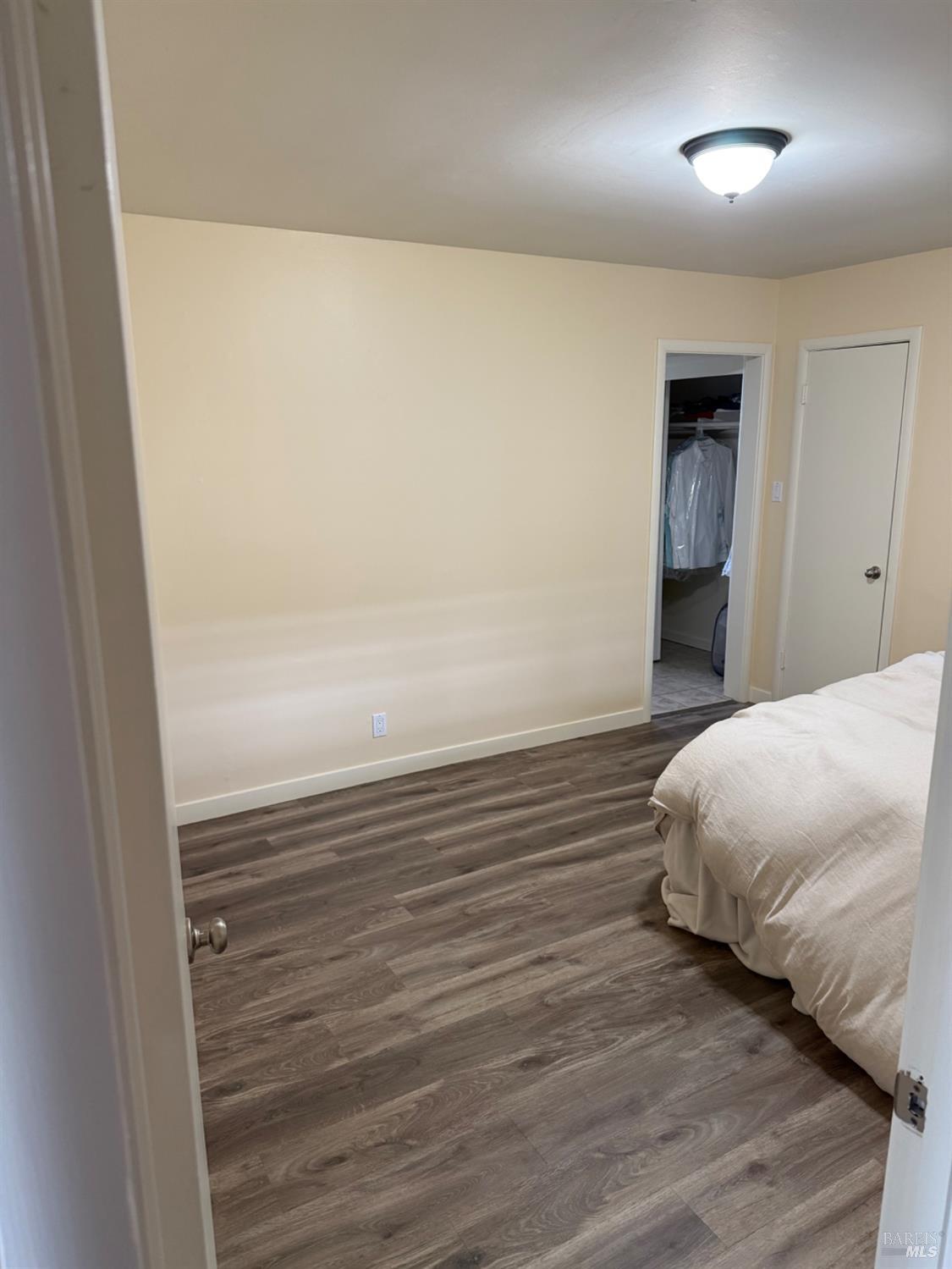 16 Harbor View Court San Rafael, CA 94901 - Photo 18 of 20 a bedroom with a bed and a window