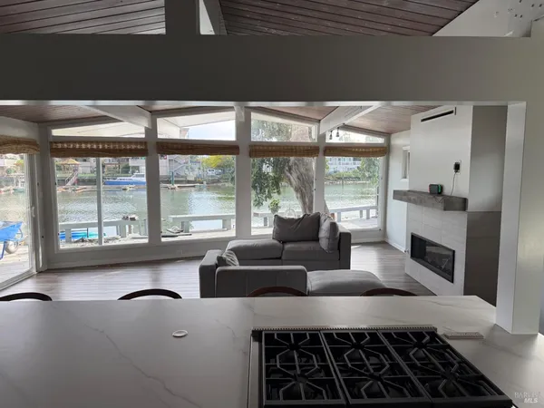 a kitchen with a table chairs and a refrigerator