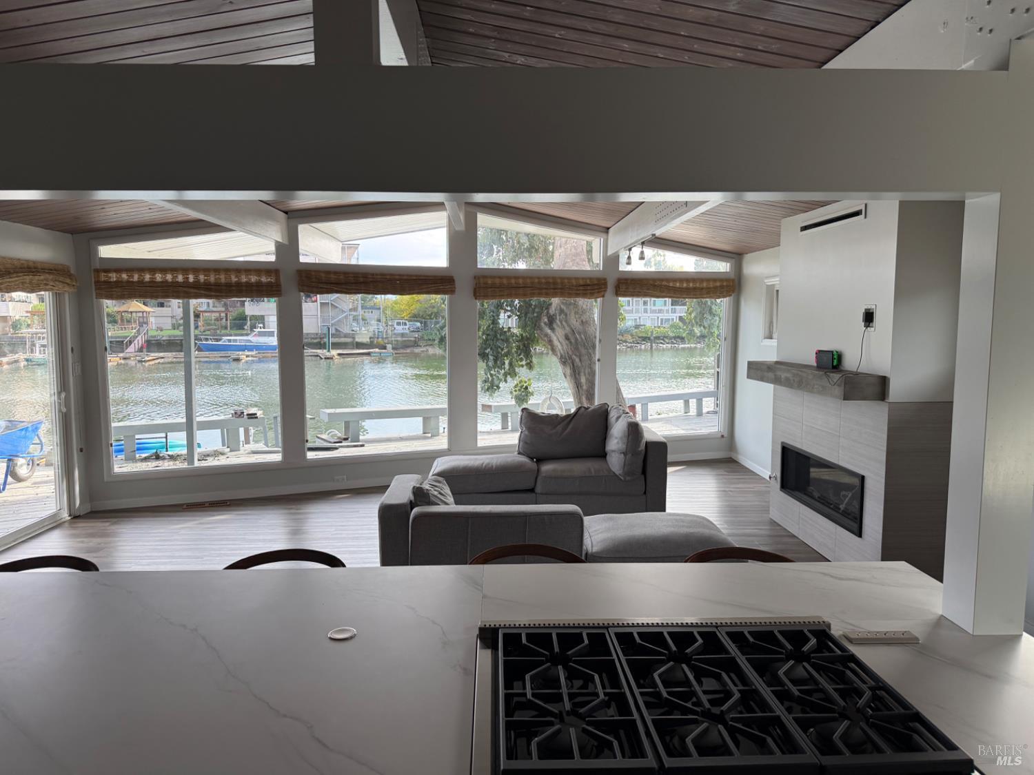 16 Harbor View Court San Rafael, CA 94901 - Photo 3 of 20 a living room with furniture and large windows