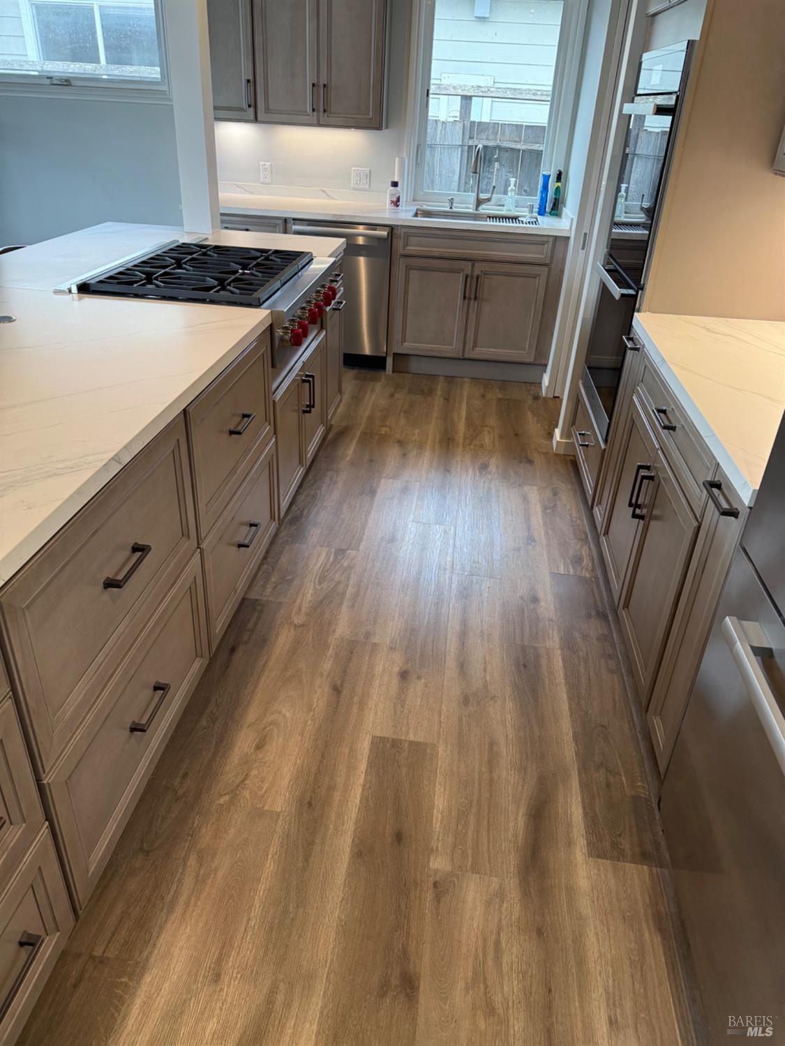 16 Harbor View Court San Rafael, CA 94901 - Photo 5 of 20 a kitchen with sink a stove and cabinets