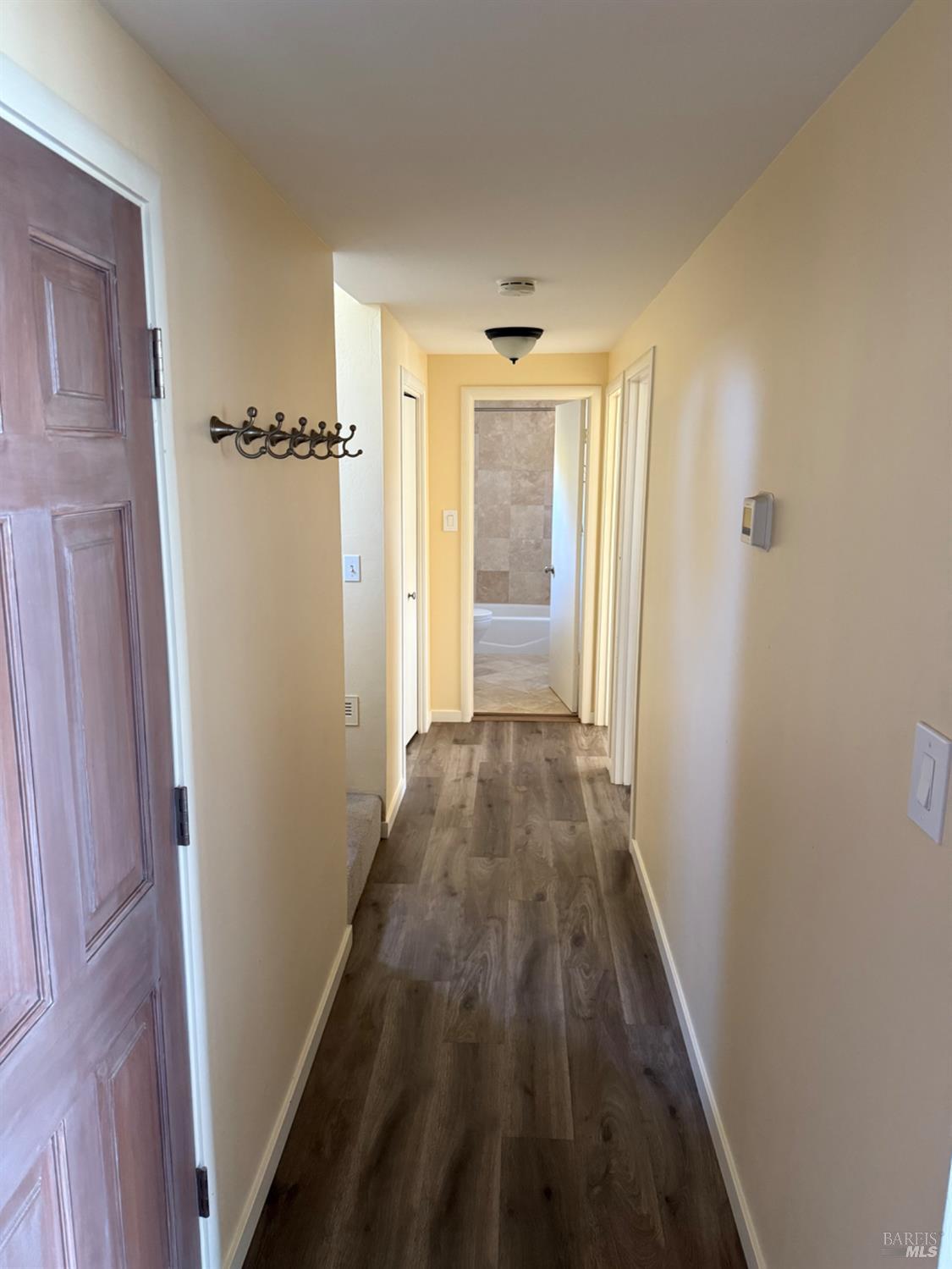 16 Harbor View Court San Rafael, CA 94901 - Photo 8 of 20 a view of a hallway with wooden floor and closet area