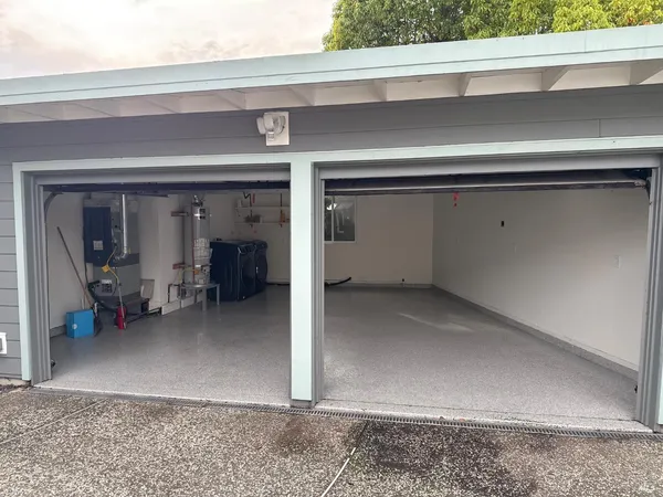 a utility room with sink dryer and washer