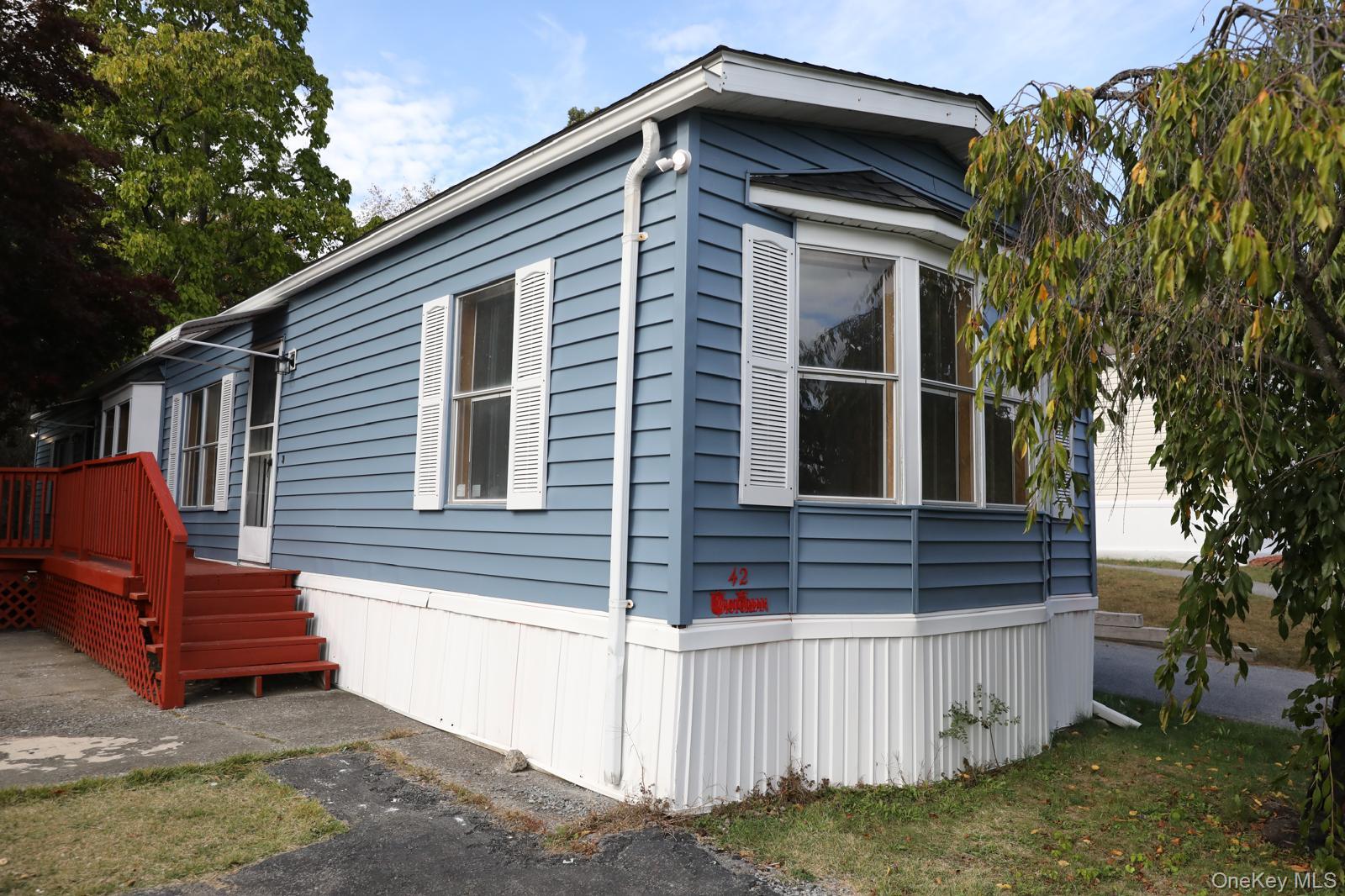 179 Van Wagner Road, Unit LOT 42 Poughkeepsie, NY 12603 - Photo 1 of 19 a front view of a house with balcony