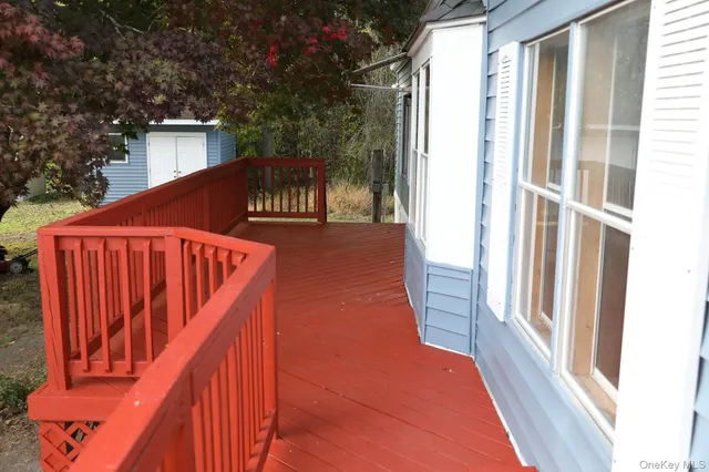 a balcony with trees in front of it