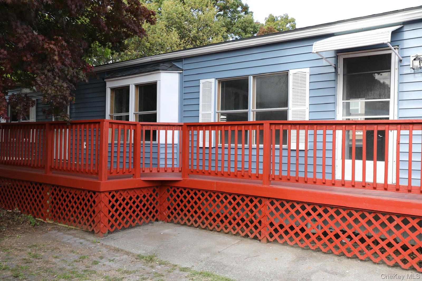 179 Van Wagner Road, Unit LOT 42 Poughkeepsie, NY 12603 - Photo 2 of 19 a view of a wooden house with a large window